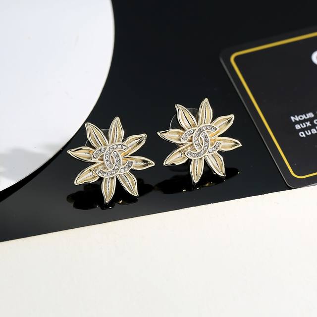 Chanel's new sunflower earrings are perfect for flattering your face. Surrounded