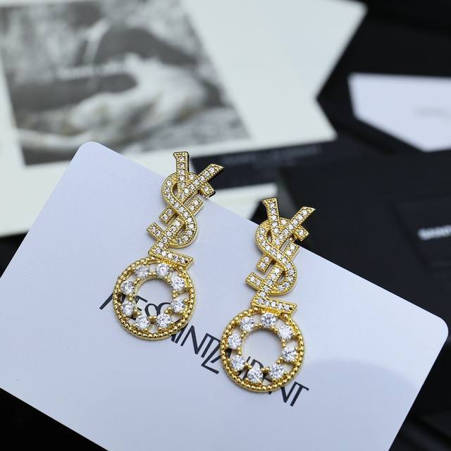 Yves Saint Laurent full diamond earrings. Founded in 1961, Yves Saint Laurent's
