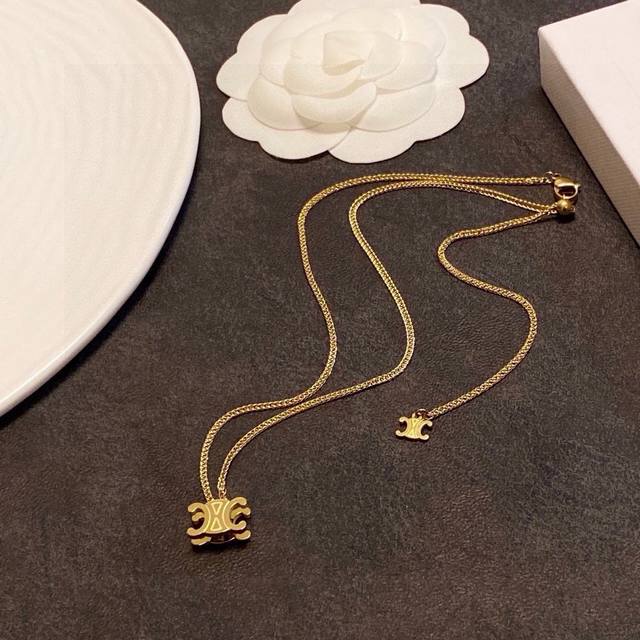Celine Arc de Triomphe pendant necklace features an Arc de Triomphe motif, which