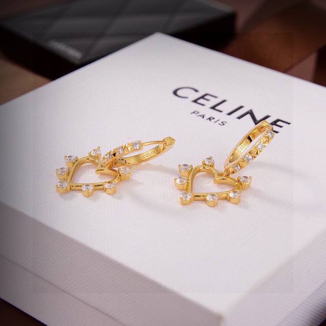 Celine's new gold heart earrings are unique in design and full of personality, s
