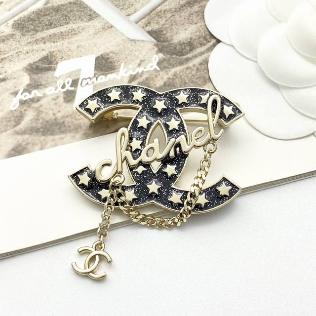 Code A624 0257825 Chanel brooches are a hot seller! The Chanel 23 Black Gold Ena