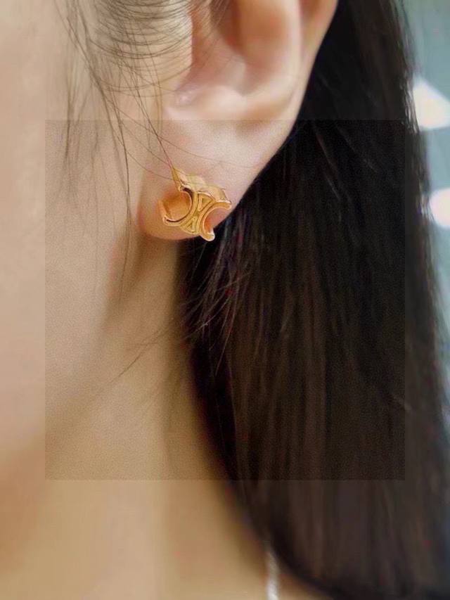 Celine's new golden Arc de Triomphe earrings are unique in design and full of pe