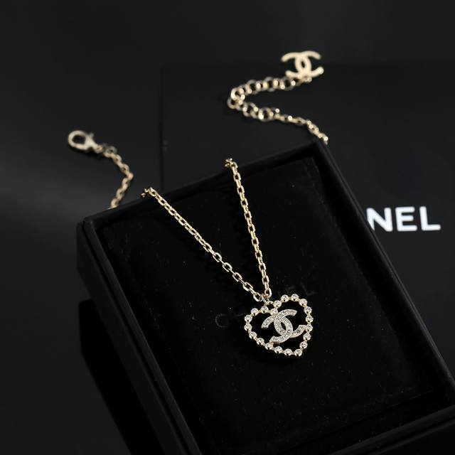 Chanel's latest heart-shaped peach necklace is made of stainless steel and retai