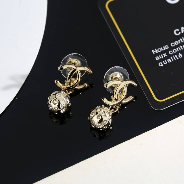 Chanel's new earrings are more flattering to your face. The gold metal rim gives