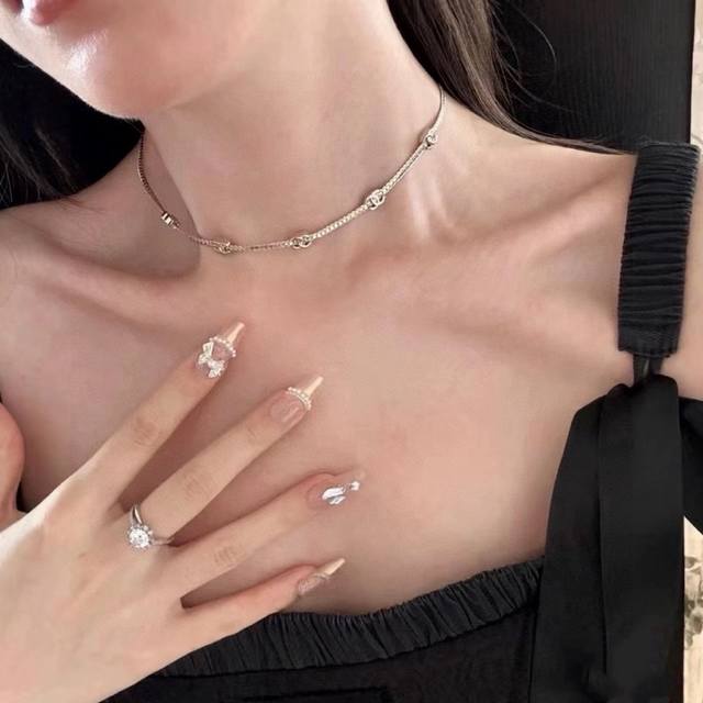 Chanel's latest 5-flower snake bone necklace. The thin snake bone is embellished