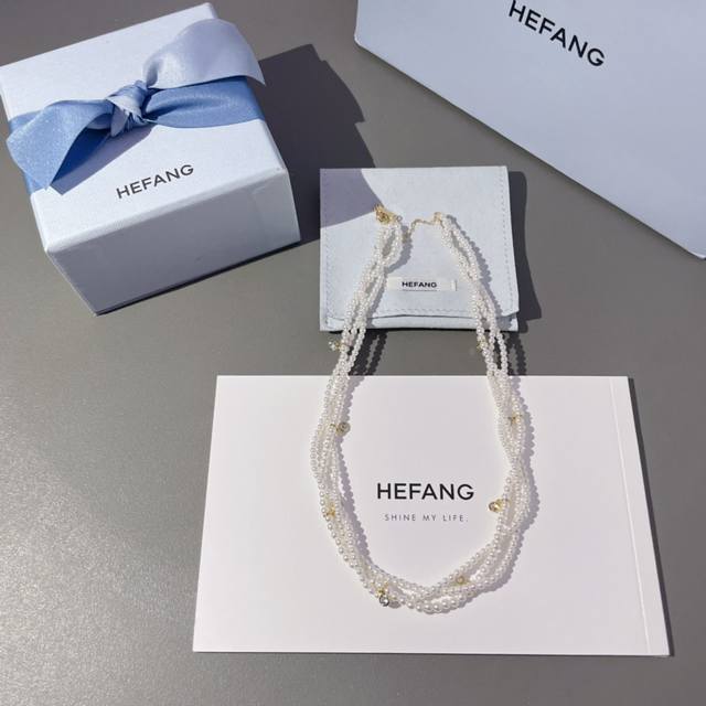 We present the Hf Twisted Pearl Necklace Z 1690, a stunning three-layer braided