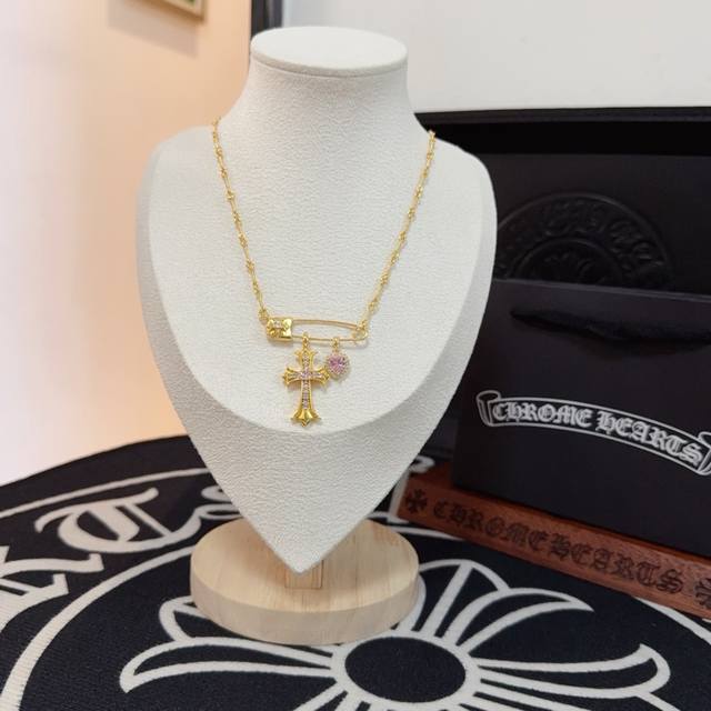 New, counter-quality Chrome Hearts brooch and purple diamond cross necklace. The