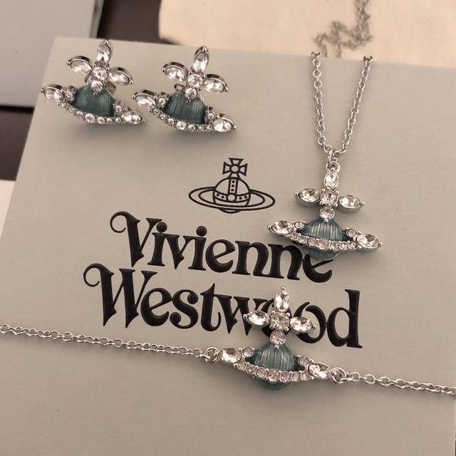 Vivienne Westwood necklace, bracelet, and earrings. What is a Happy Planet? Come