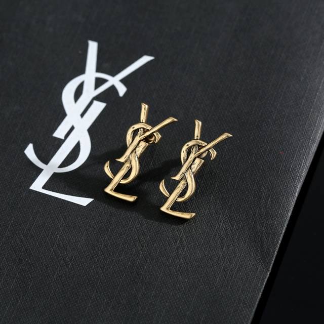 Yves Saint Laurent earrings, original brass. Founded in 1961, Yves Saint Laurent