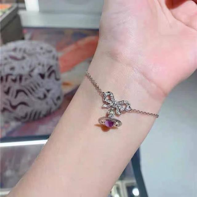 Classic Purple Saturn Bracelet by Vivienne Westwood, the British fashion designe