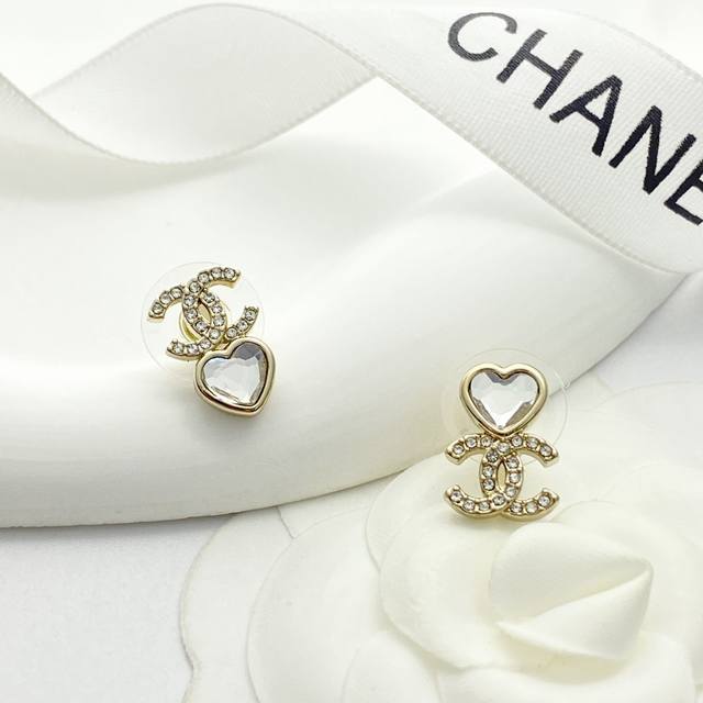 Chanel earrings are a hot seller! New Chanel 25 asymmetrical rhinestone heart do
