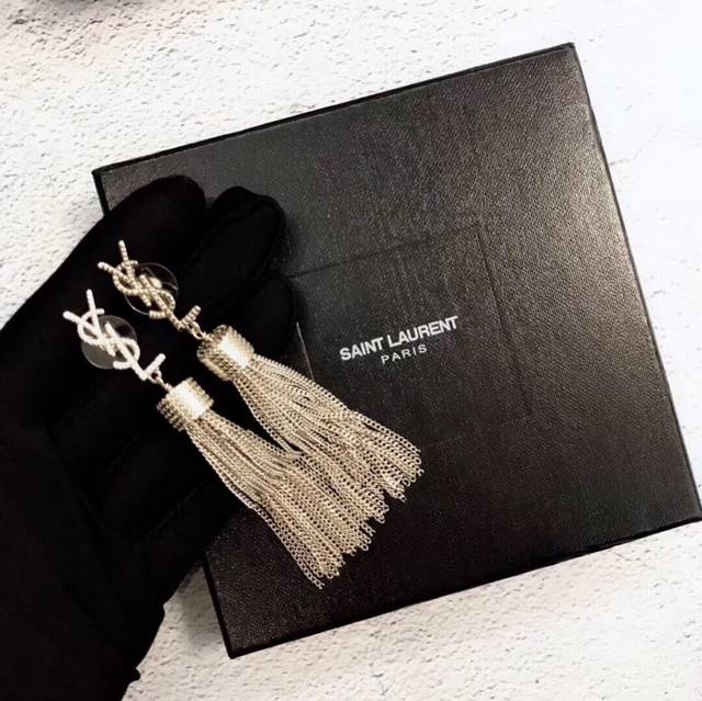 Yves Saint Laurent Tassel Earrings, Original Brass. Founded in 1961, Yves Saint