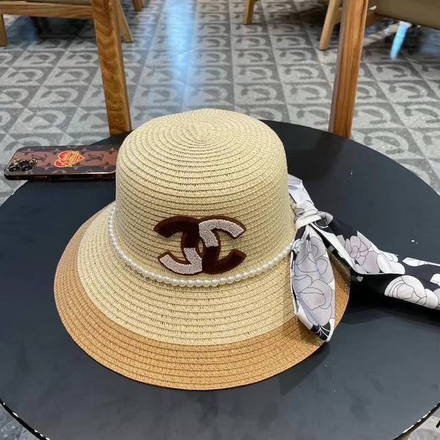 Chanel new straw hat with camellia ribbon, ladylike style, details to be added,