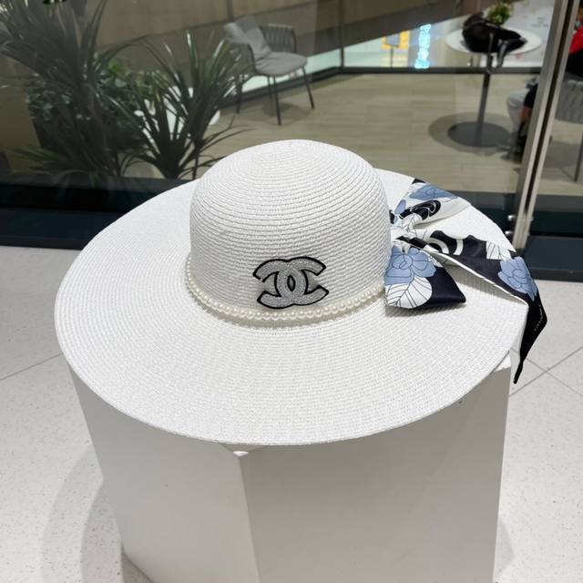 Dior's new Chanel holiday-style wide-brimmed straw hat, a must-have for travel,