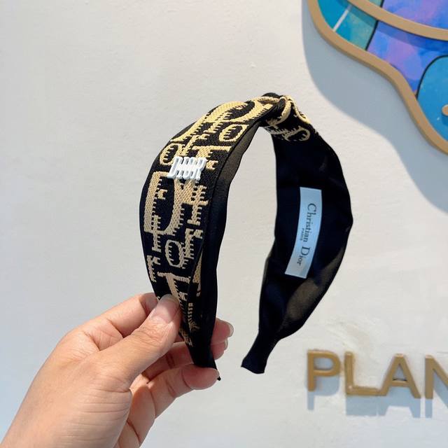 with packaging Dior's hottest new wide knotted headband, the original headband