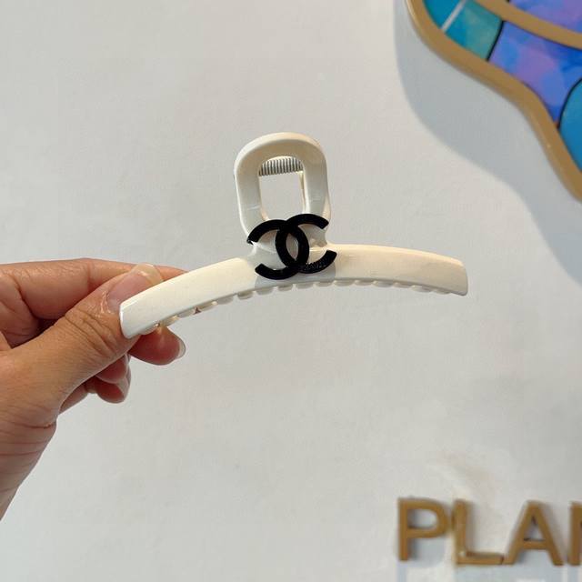 with packaging Chanel's new handmade diamond-embellished hairpin, a high-end, s