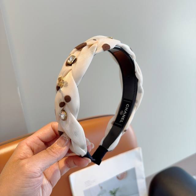 with packaging Chanel's new diamond-studded small headband, a new product that