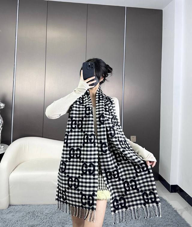 New color to Gucci's new scarf, the double G jacquard cashmere long scarf, is f