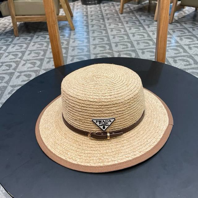 Prada's new big-name brand woven raffia flat-top straw hat, a must-have for goin