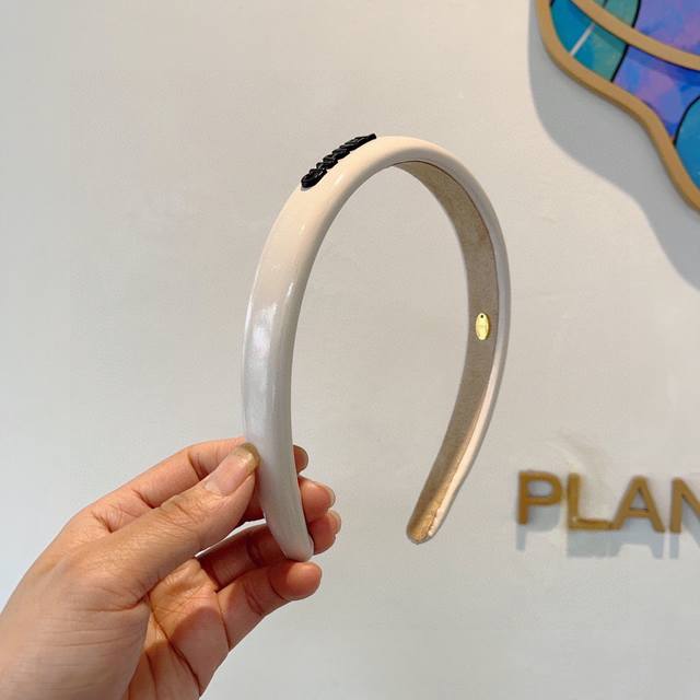 with packaging Chanel's new patent leather high-end headband, a new product tha