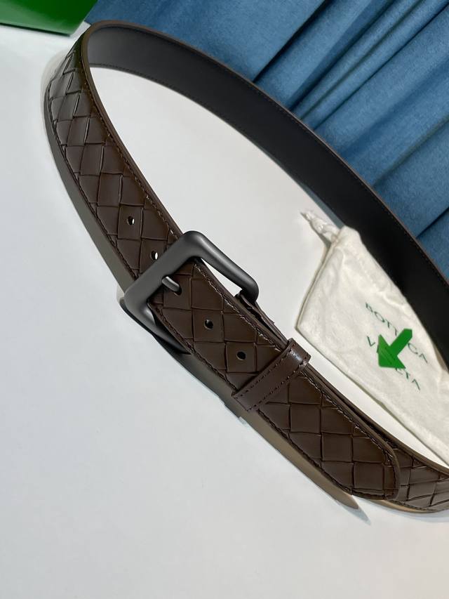 s new hand-woven leather belt adds an elegant touch to casual or formal looks, e