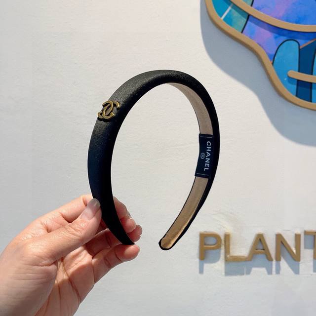 with packaging Chanel's latest small satin headband, a new product that makes y