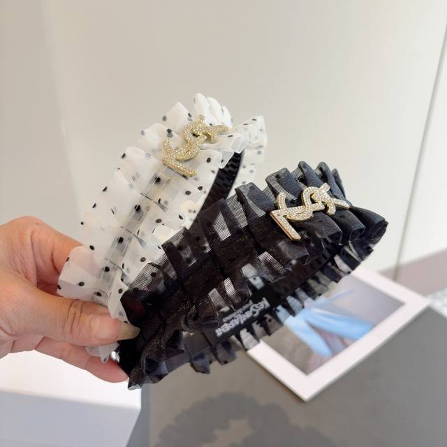 with packaging Yves Saint Laurent's new trendy high-end pleated headband, simpl