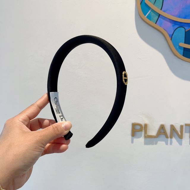 with packaging Dior's new narrow, high-end, designer headband, a popular online