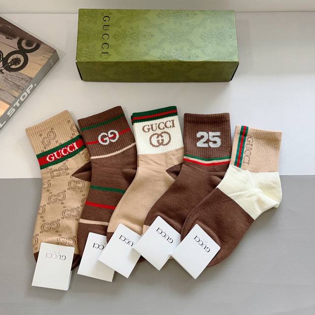 comes with a box of 5 pairs of Gucci's new mid-calf socks! Pure cotton fabric,