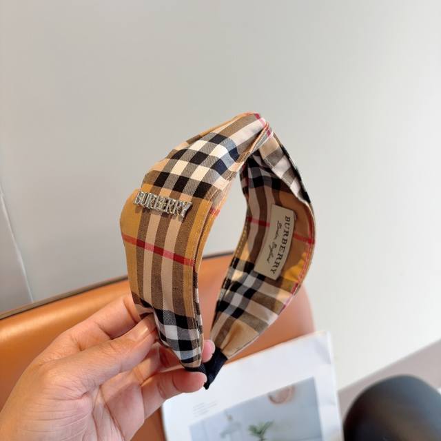 with packaging Burberry's new high-end cross-over headband, with all the detail