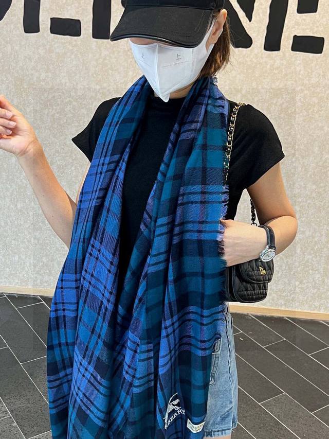 Burberry...embroidered warhorse scarf made of imported Nepalese cashmere...a cut