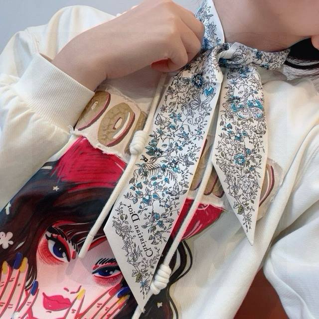 This Mitzah scarf is crafted from white silk twill and embellished with the pale