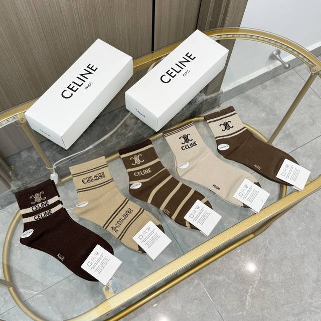 Comes with a box of five pairs of Celine's popular mid-calf socks in the tall v