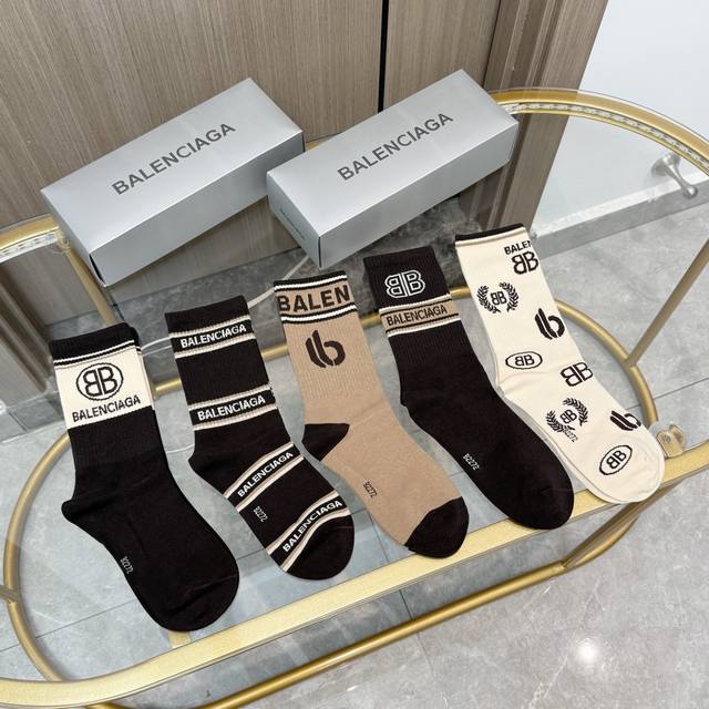 Comes with a box of five pairs of Balenciaga socks. They're so beautiful! These
