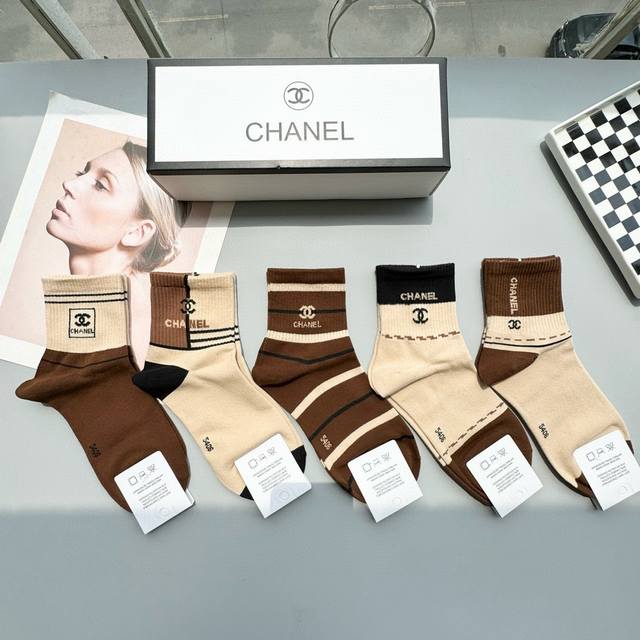 Comes with a box of five pairs of Chanel's popular mid-calf socks in the tall v