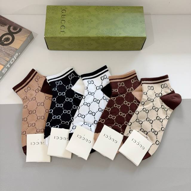 comes with a box of 5 pairs of Gucci's new short socks! Classic Gg letters, cou
