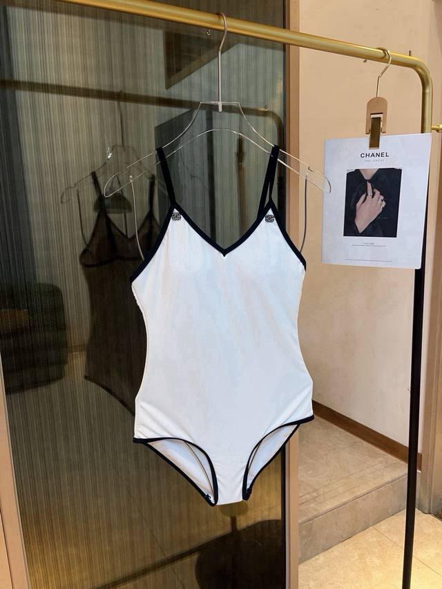 Chanel One-Piece Swimsuit. Perfect for a variety of occasions.