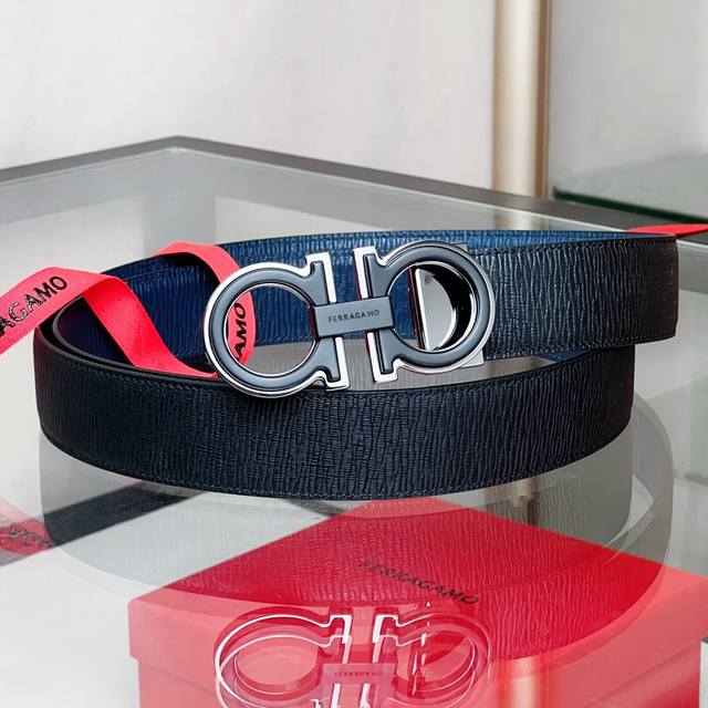Ferra~Double-Sided Adjustable Gancini Belt This belt is made of soft cowhide and