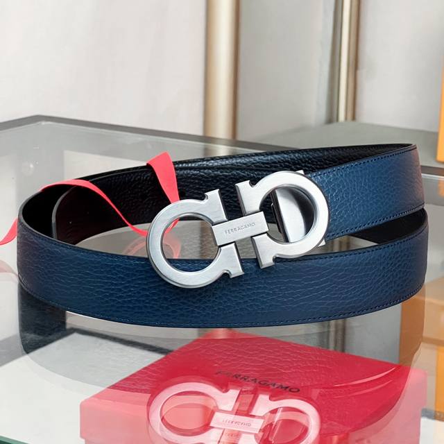 Ferra~Double-Sided Adjustable Gancini Belt This double-sided, two-tone belt rein
