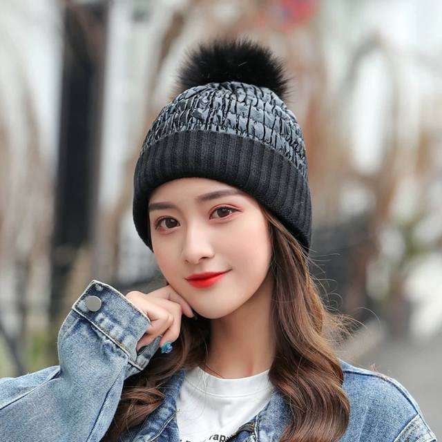 Moncler wool knitted beanie with detachable ball for easy pairing. High-quality