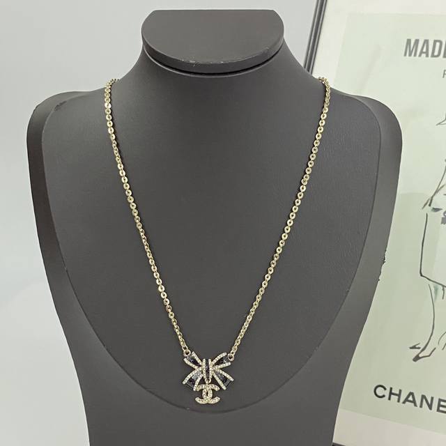 Chanel necklaces are hot sellers! New arrival! Chan 25 Black Gold Enamel Bow Dou