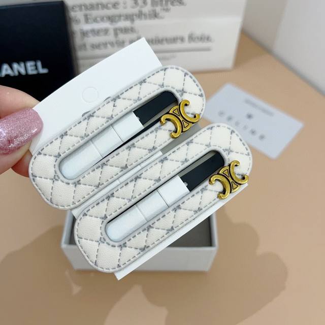 comes with a pair of Celine Arc de Triomphe new hair clips, classic Bb clips, b