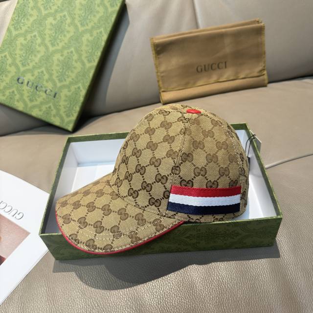 comes with a box bag. This is a new Gucci baseball cap. It features a three-col