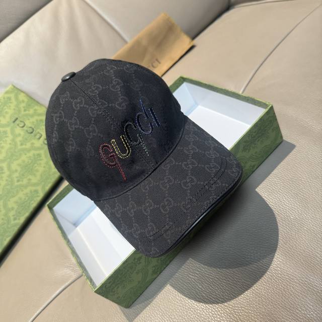 comes with a box bag. This new Gucci baseball cap features embroidered art. Mad