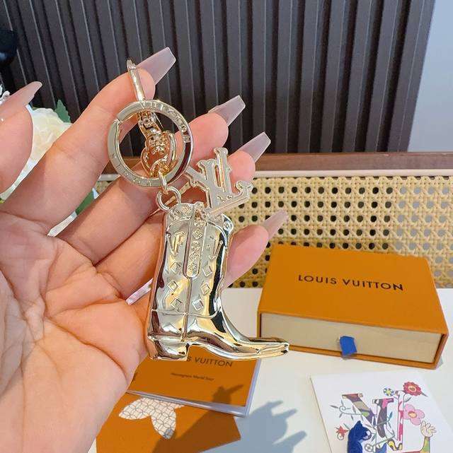 Lv keychain, boot charm, and car key charm feature the brand's signature logo cl