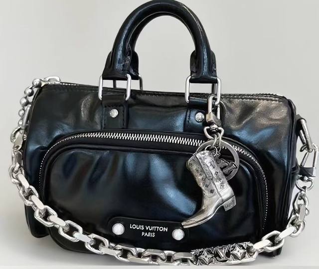 Lv keychain, boot charm, and car key charm feature the brand's signature logo cl