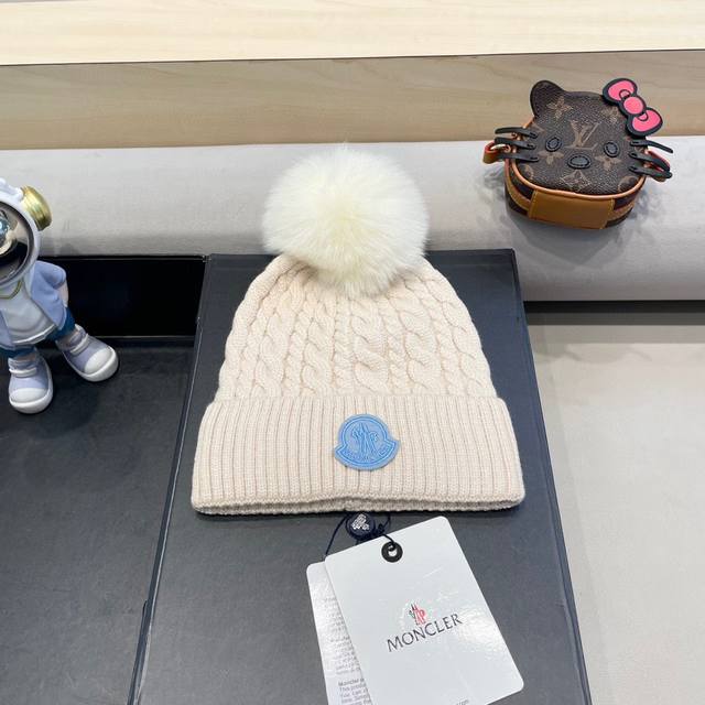 Moncler knitted beanie with ball! A winter favorite for young ladies~ Looks grea