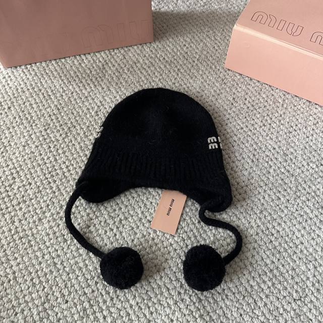 Miumiu new autumn and winter knitted wool hat This is so cute! The earmuffs are