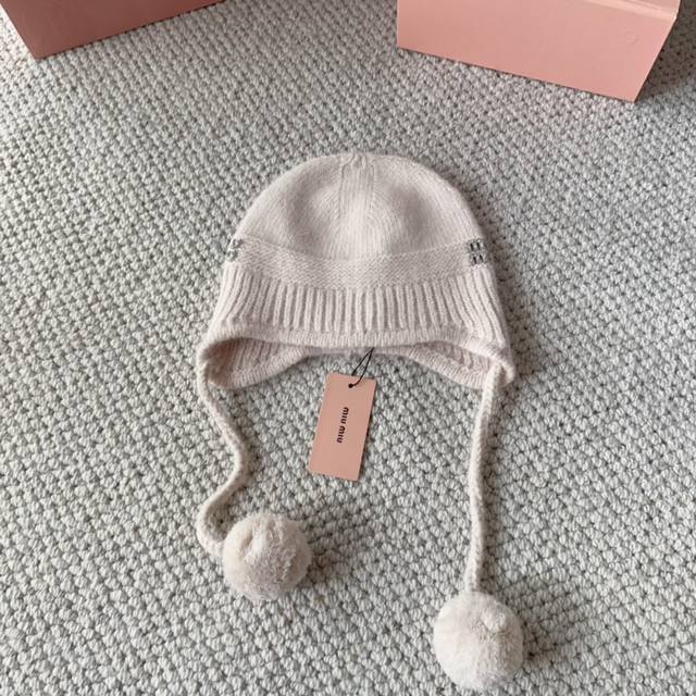 Miumiu new autumn and winter knitted wool hat This is so cute! The earmuffs are