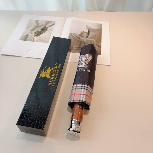 Burberry's tri-fold, self-folding umbrella is the pinnacle of the year. Classic,